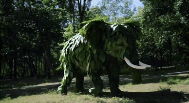 Prompt:“一只由树叶制成的大象在丛林中奔跑。”